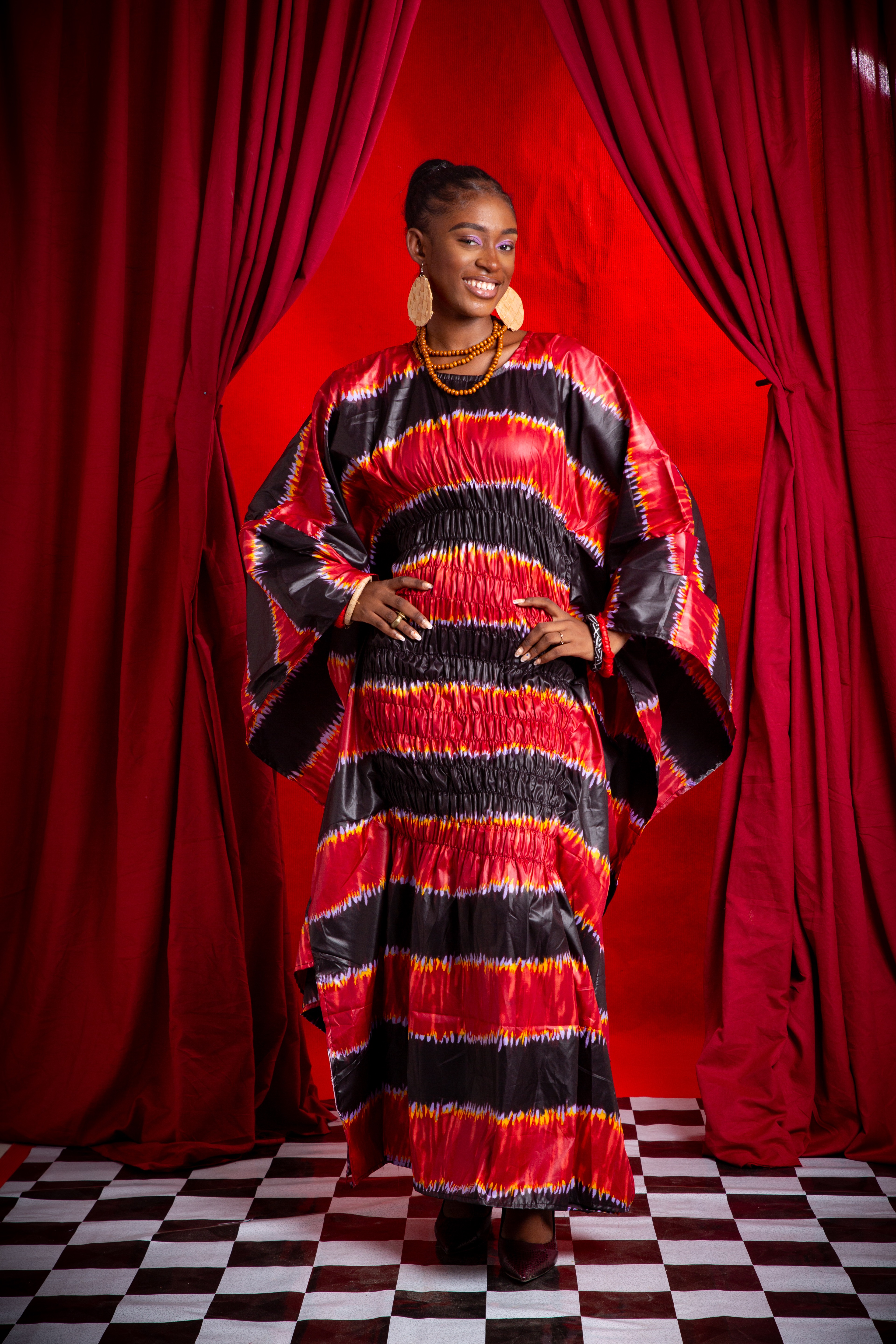 Image 1 of Nden Bobo Red batik shirred boubou dress (TEGUE)