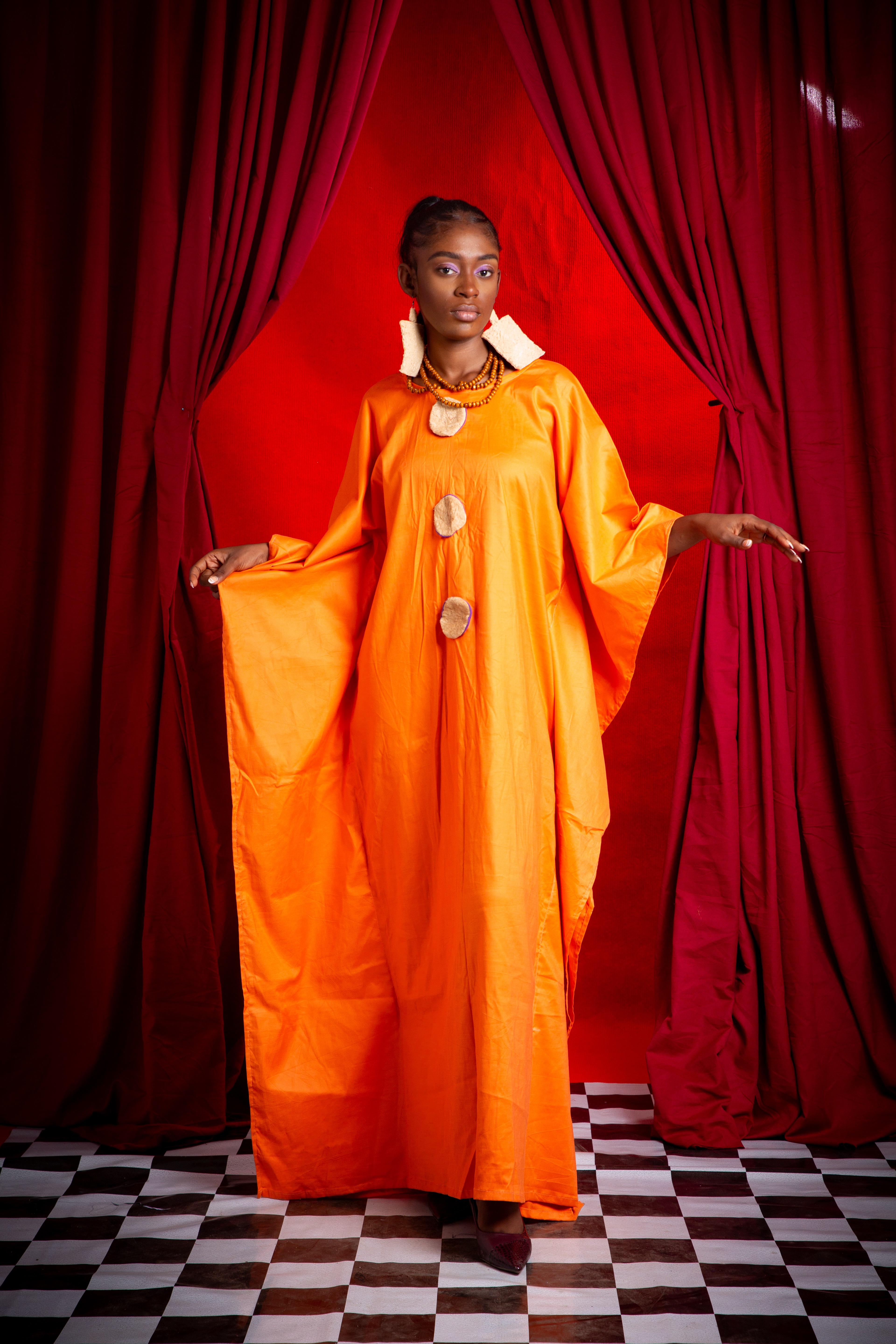 Image 1 of Nden bobo orange cotton boubou dress with obom decorations (TEGUE)